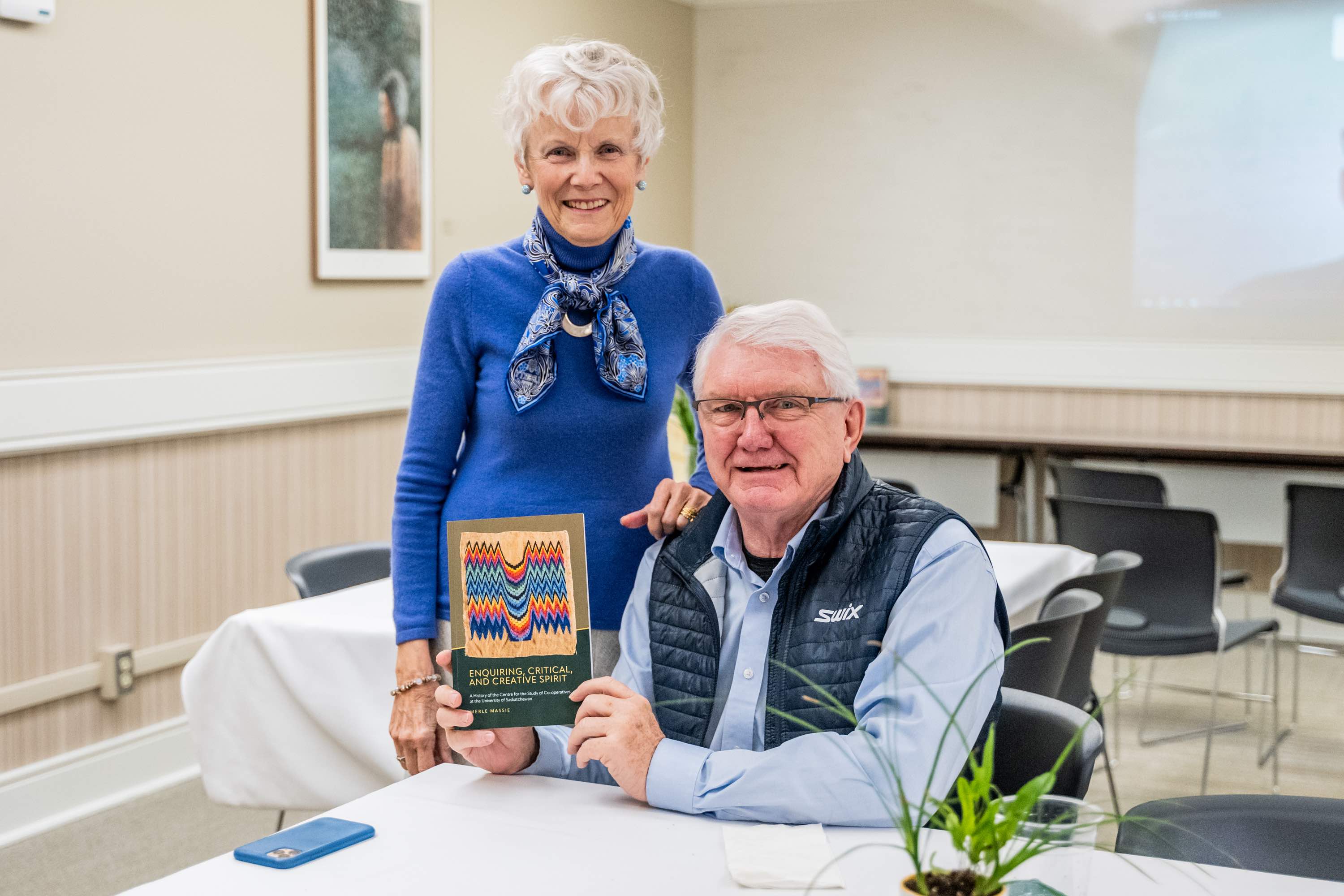 CCSC 40th Anniversary Event - Attendees Posting with the Enquiring, Critical, and Creative Spirit Book